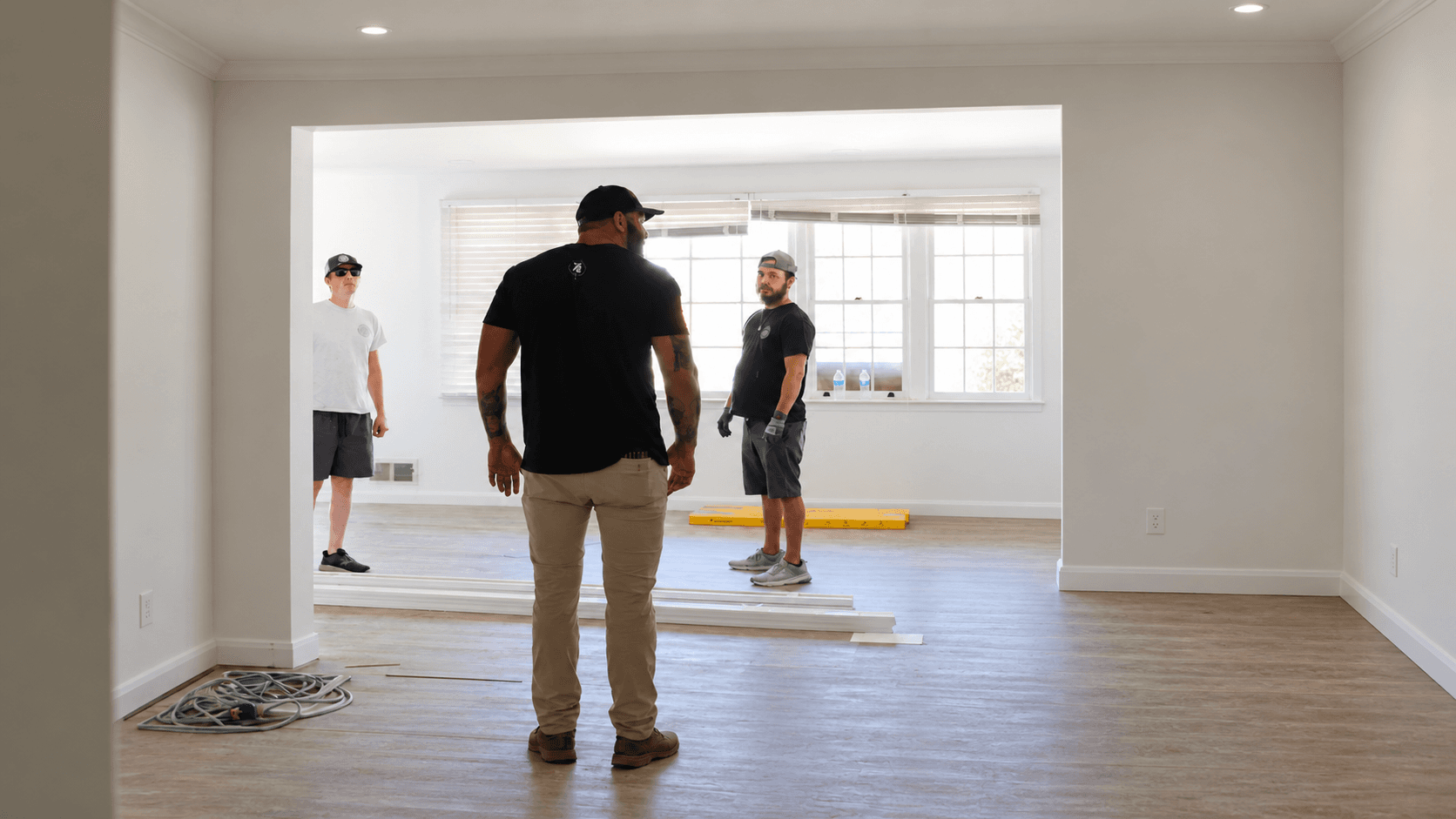 David Harkins on site reviewing work with his team